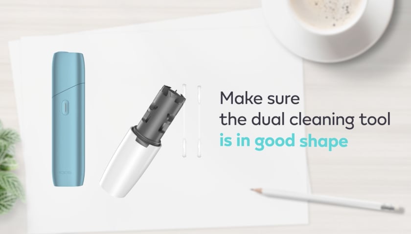 IQOS Originals One y herramienta de limpieza.